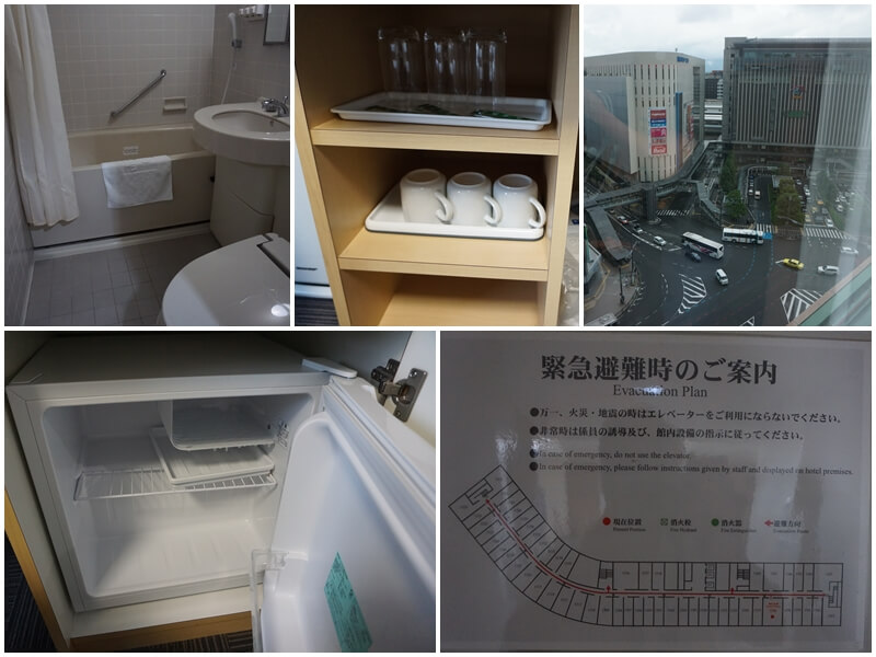 博多舒適飯店Comfort Hotel Hakata的浴廁、小冰箱與外面景觀